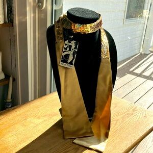 Gold sequins and satin to brighten any outfit.